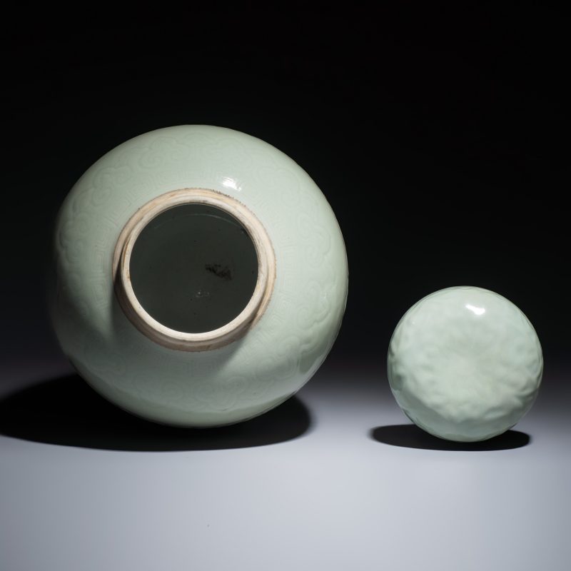 A Chinese celadon-glazed covered vase with floral relief design - 图6