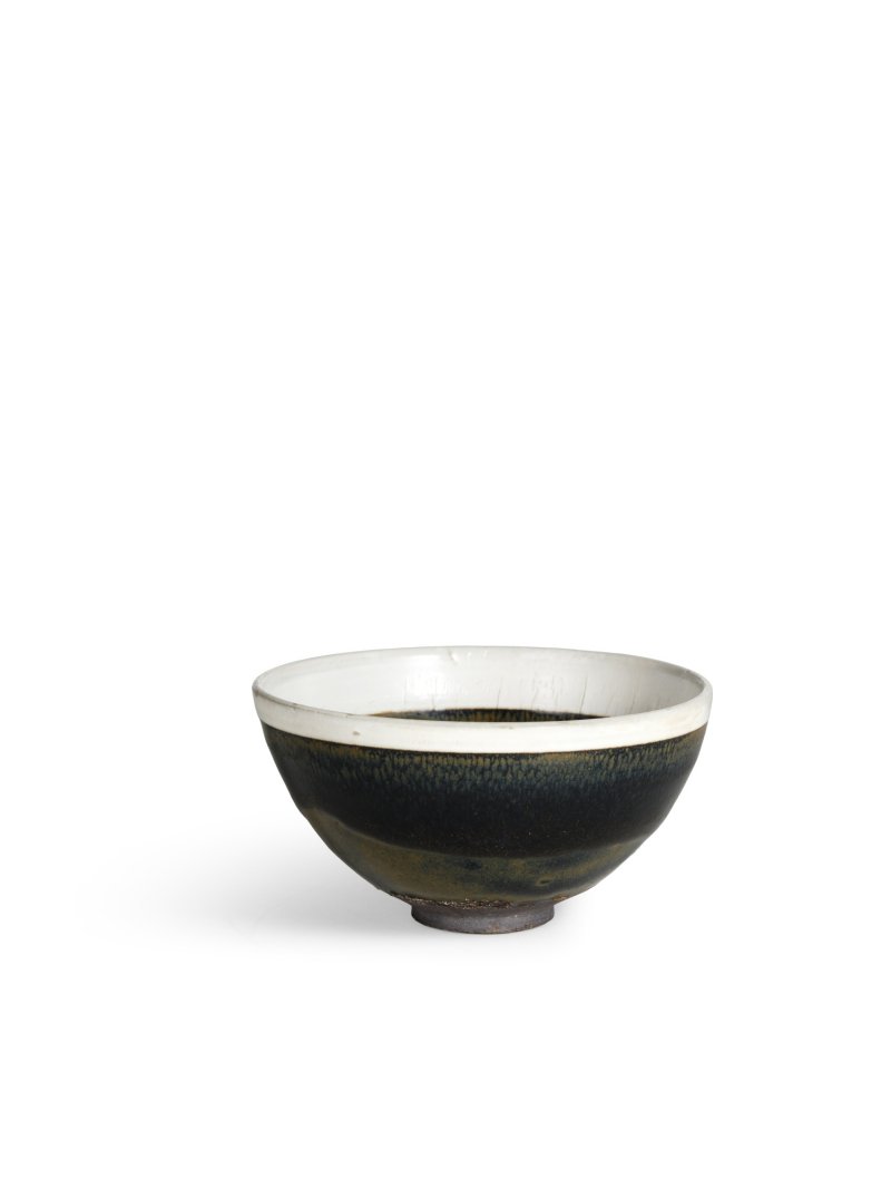 A black-glazed white-rimmed tenmoku tea bowl, Jin dynasty | 金　黑釉白覆輪天目茶盌