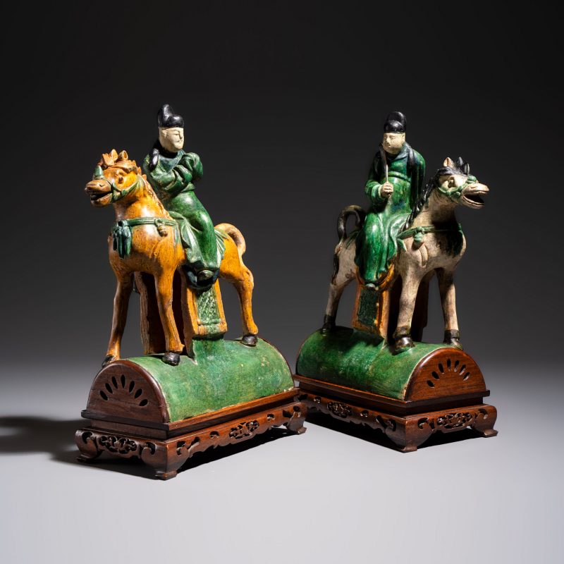 A pair of Chinese sancai-glazed stoneware 'Horseriders' roof tiles on later wooden stands - 图1