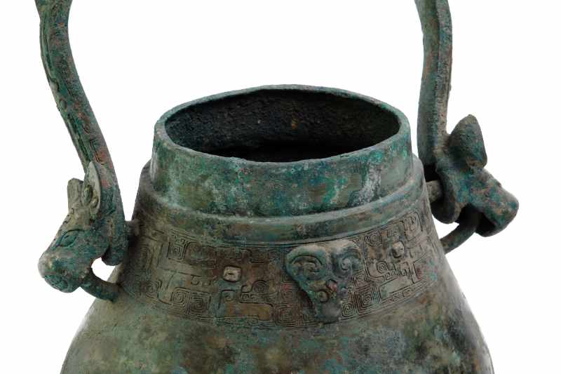 An archaic inscribed bronze wine vessel and cover, You - 图10