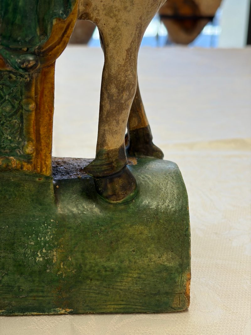 A pair of Chinese sancai-glazed stoneware 'Horseriders' roof tiles on later wooden stands - 图17