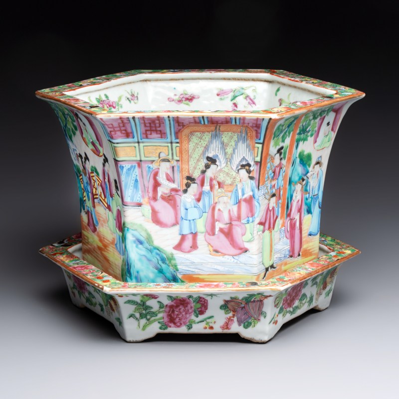 A Chinese Canton famille rose hexagonal planter and stand with narrative design
