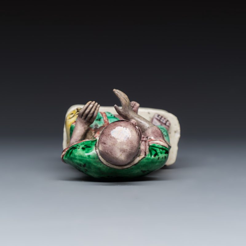 A Chinese famille verte sancai biscuit model of a seated Luohan on a tiger - 图6