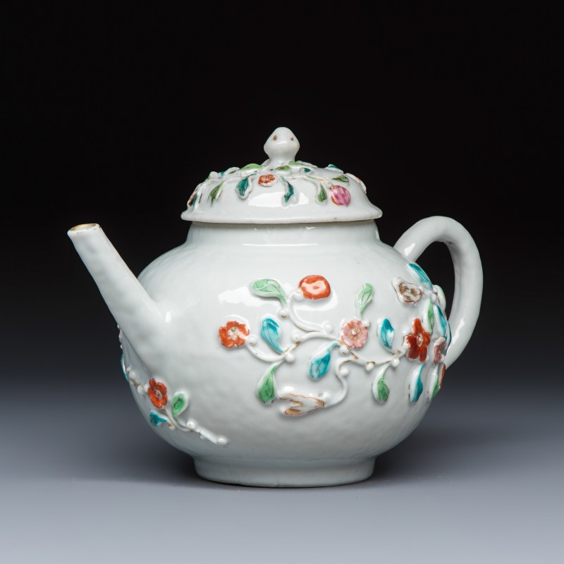 A Chinese famille rose relief-decorated teapot with floral design