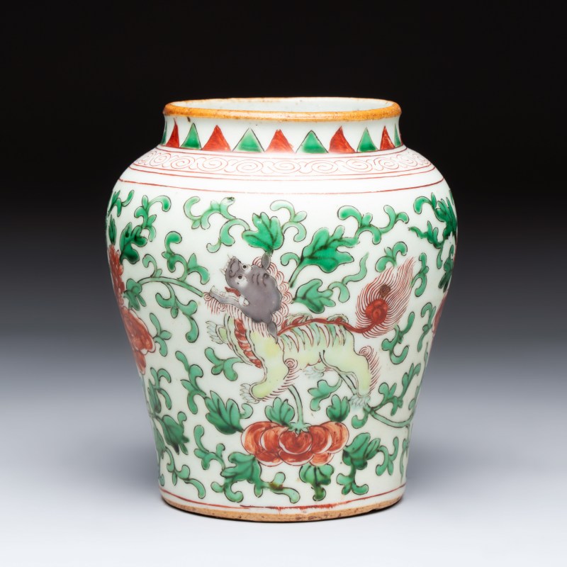 A small Chinese wucai 'Buddhist Lions and Peony Scrolls' jar