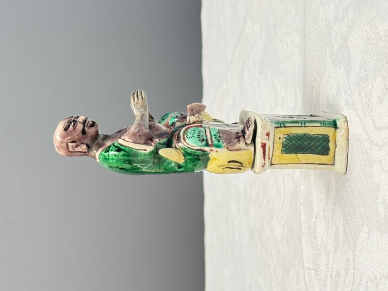 A Chinese famille verte sancai biscuit model of a seated Luohan on a tiger - 图9