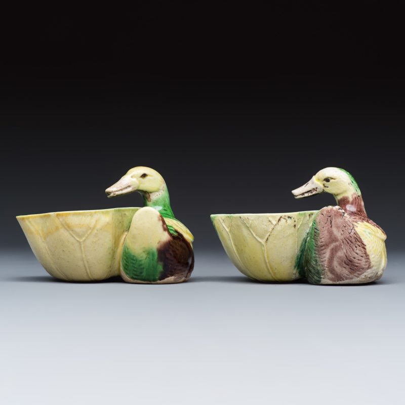 A pair of Chinese famille verte sancai biscuit duck-and-lotus-form water droppers on later wooden stands - 图3