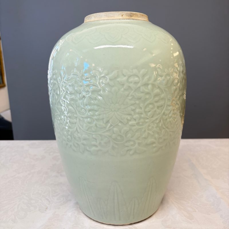 A Chinese celadon-glazed covered vase with floral relief design - 图9