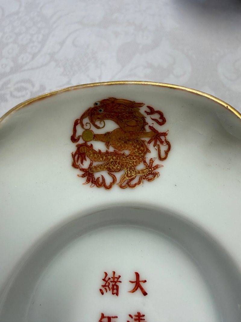 A fine Chinese iron-red and gilt-decorated 'Dragon' covered tea bowl with stand - 图36