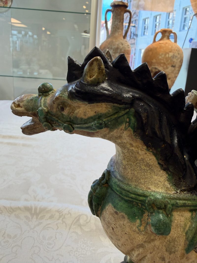 A pair of Chinese sancai-glazed stoneware 'Horseriders' roof tiles on later wooden stands - 图20