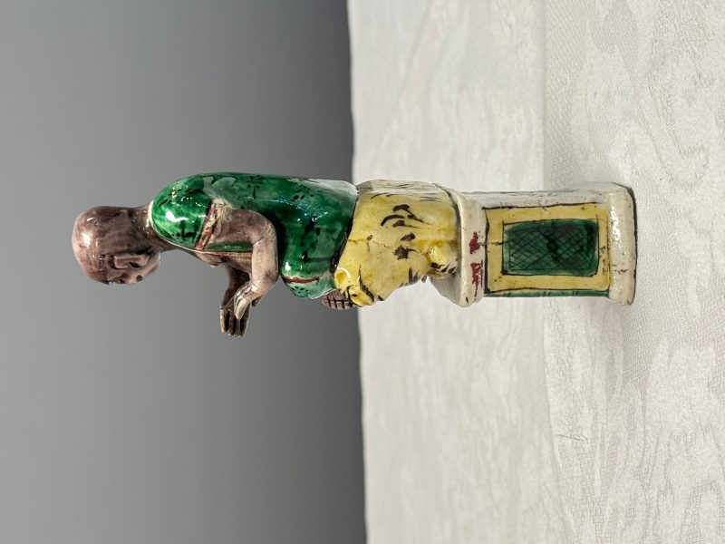 A Chinese famille verte sancai biscuit model of a seated Luohan on a tiger - 图11
