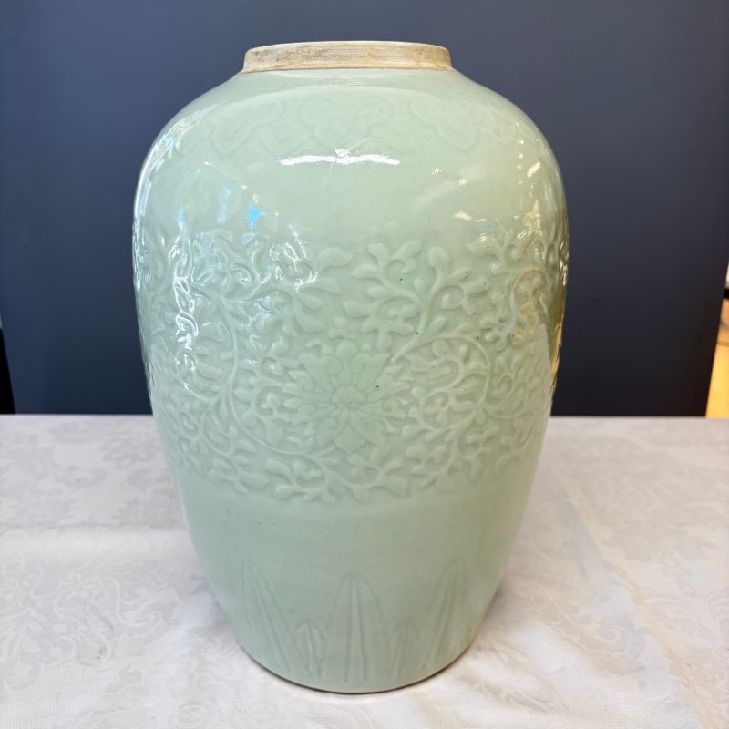A Chinese celadon-glazed covered vase with floral relief design - 图12