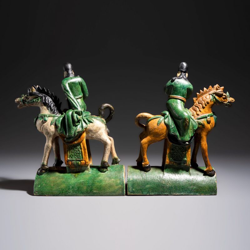 A pair of Chinese sancai-glazed stoneware 'Horseriders' roof tiles on later wooden stands - 图5
