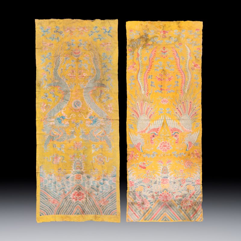 A pair of Chinese yellow-ground embroidered 'Dragons' and 'Phoenixes' panels