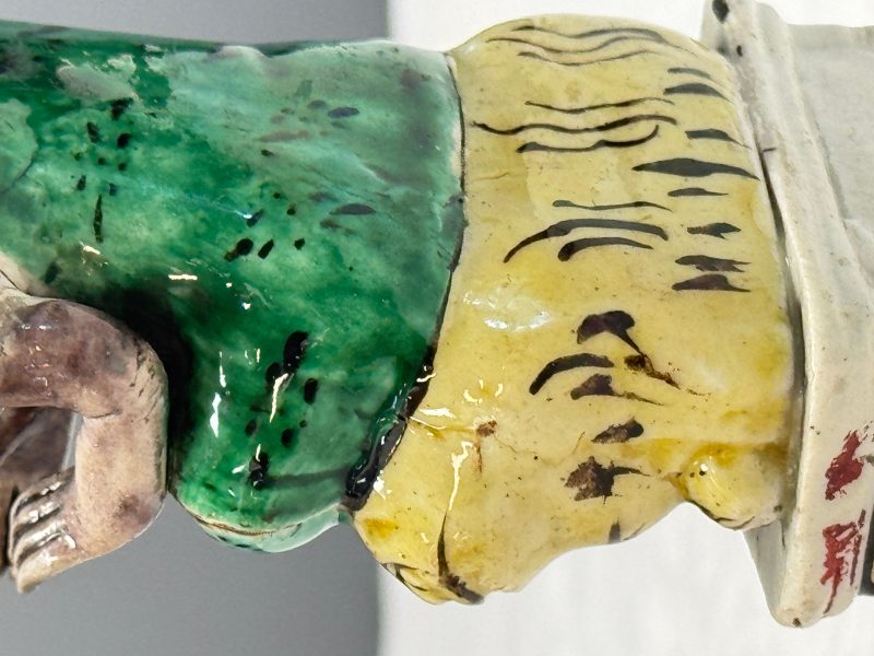 A Chinese famille verte sancai biscuit model of a seated Luohan on a tiger - 图12