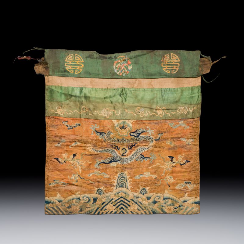 A Chinese embroidered silk 'Dragon and Phoenixes' panel