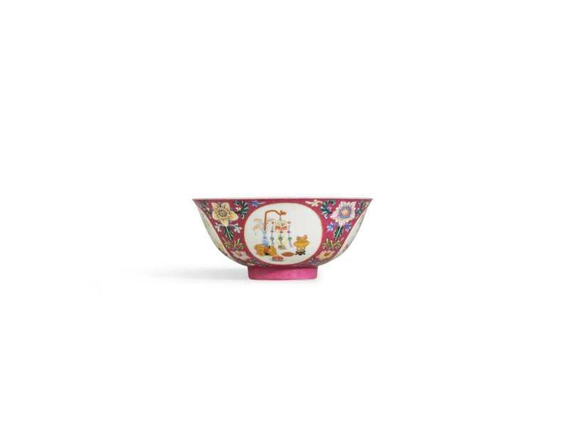 A fine ruby-ground famille-rose sgraffiato ‘medallion’ bowl, Seal mark and period of Qianlong | 清乾隆　胭脂紅地軋道洋彩開光五穀豐登膳盌　 《大清乾隆年製》款