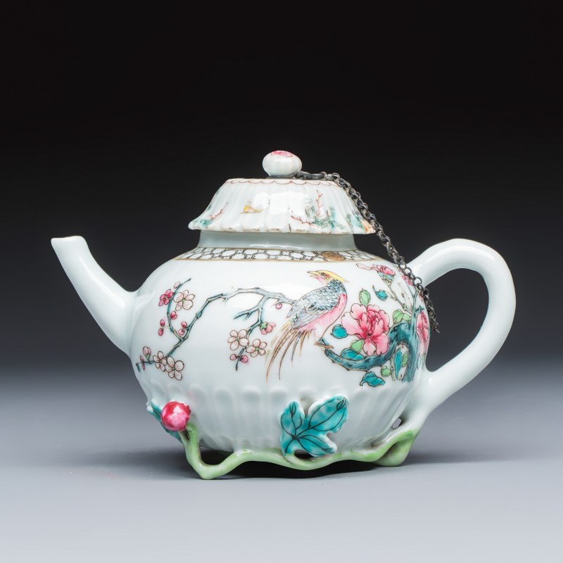 A Chinese famille rose 'Pheasant among Flowering Branches' teapot and cover with relief design