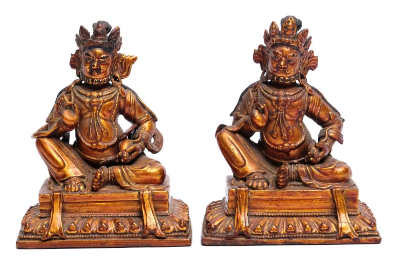 A pair of gilt-lacquered wooden figures of Jambhala