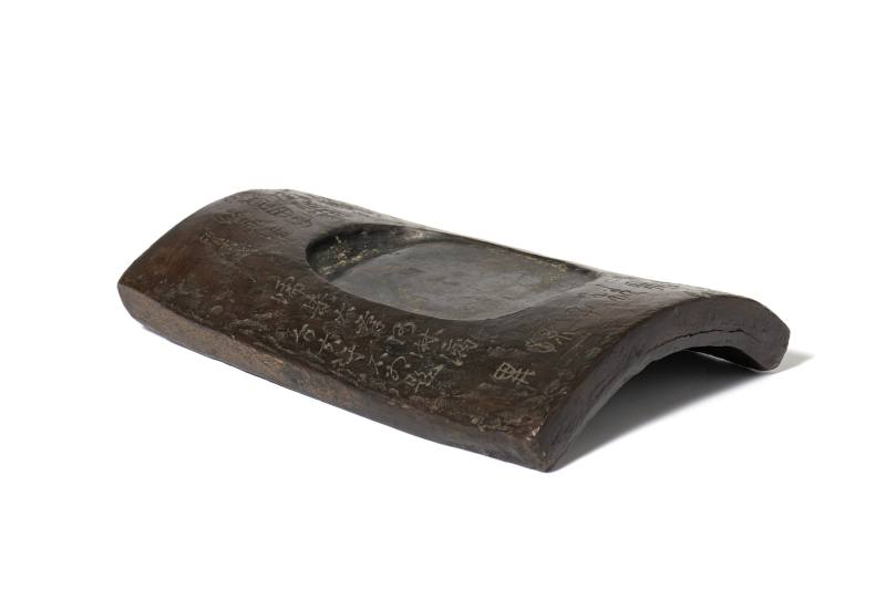A tile-shaped inkstone with archaistic inscription