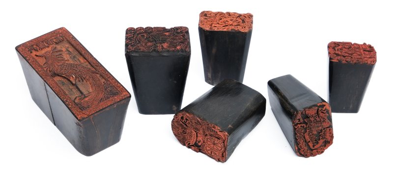 Six carved horn stamps