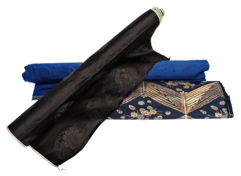 Three silk fabric bolts