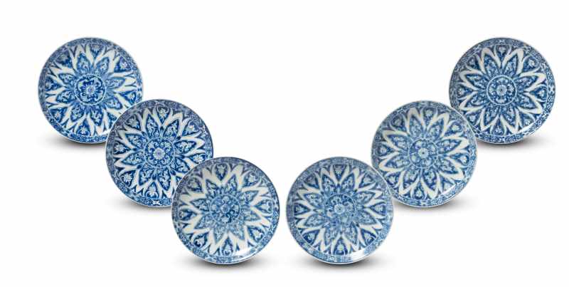 A set of six blue and white 'floral' saucer dishes
