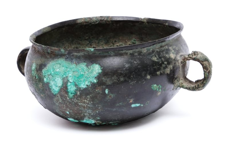 An archaic bronze oval cup with ring handles, He