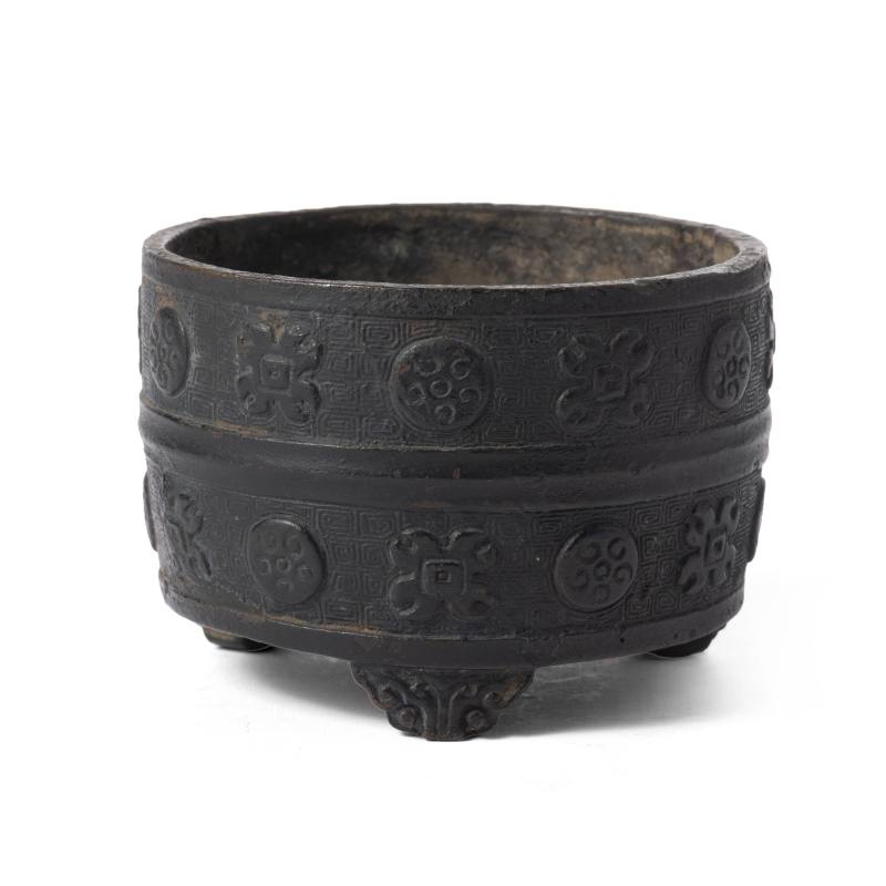 A bronze censer with relief ornamentation
