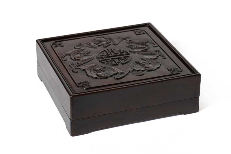 A carved hardwood 'bats'-covered box