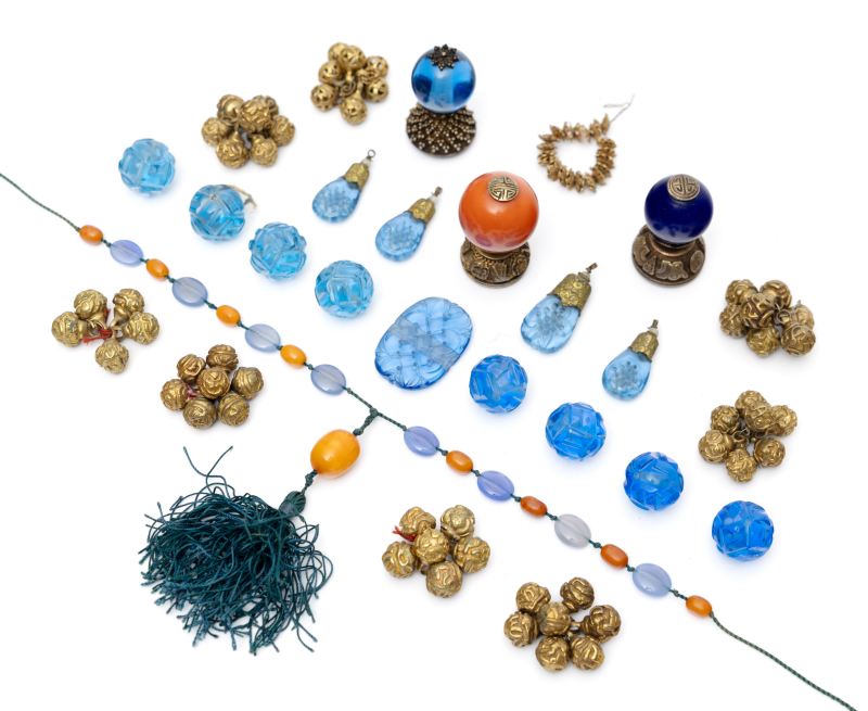 Three hat finials with a large number of buttons and glass beads/ornaments