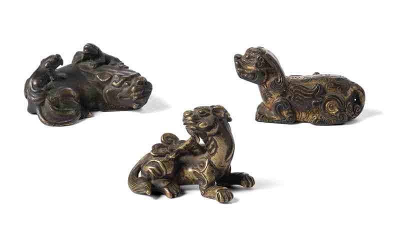 Three bronze parcel-gilt weights