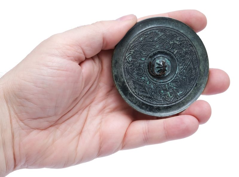 A small bronze mirror with incised decoration - 图3