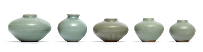 A set of five plain Longquan celadon jars