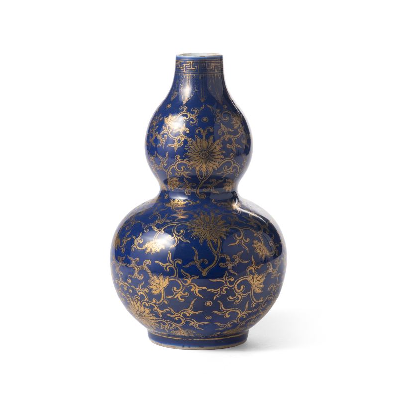 A blue-ground gilt-decorated double-gourd vase