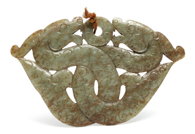 A large spinach-green jade 'entwined dragons' pendant