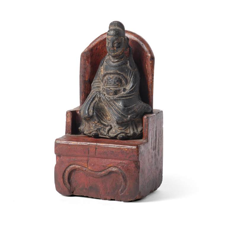 A small bronze figure of Wenchang, seated on a wooden chair