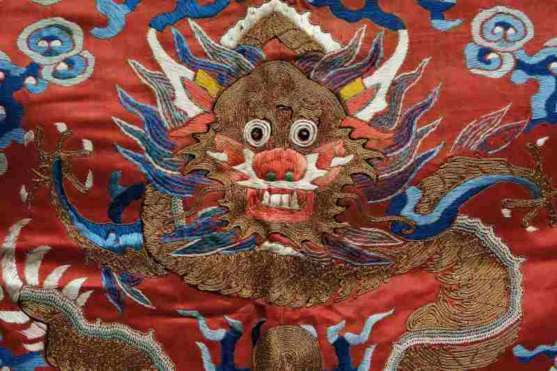 A silk red-ground embroidered dragon robe panel - 图4