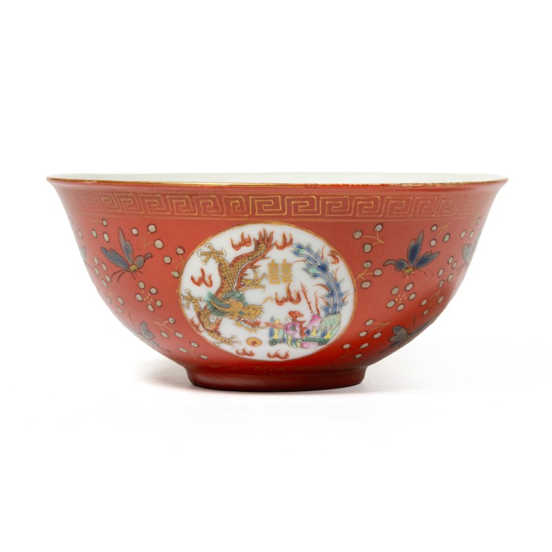 A coral-ground famille rose and gilt decorated 'dragon medallion' bowl
