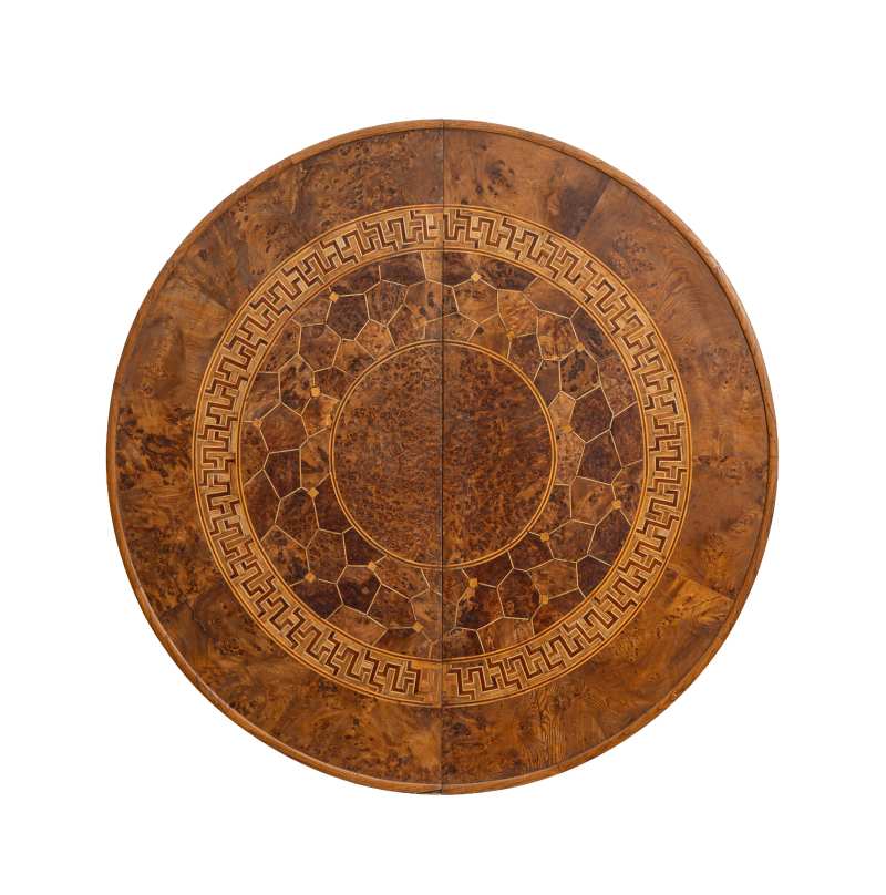 A hardwood parquetry inlaid circular table