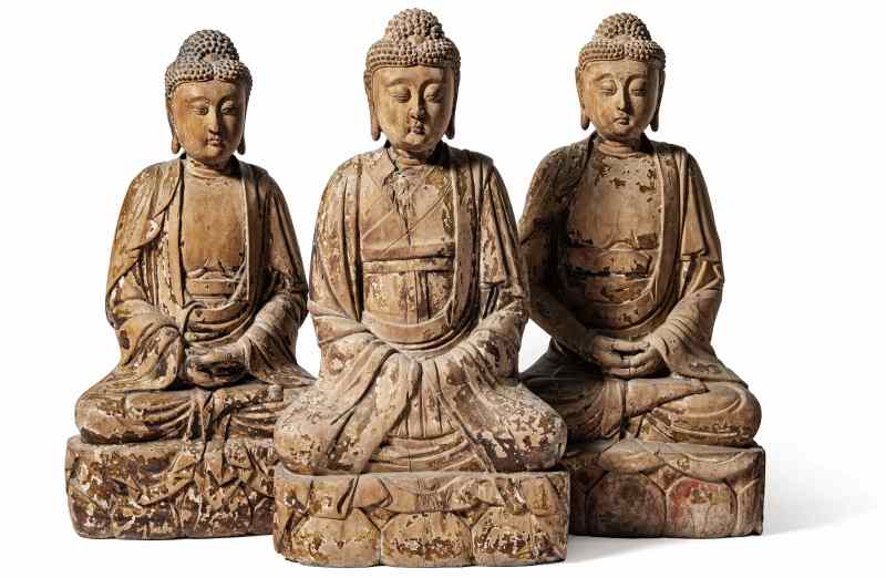 Three larger wooden Buddha figures