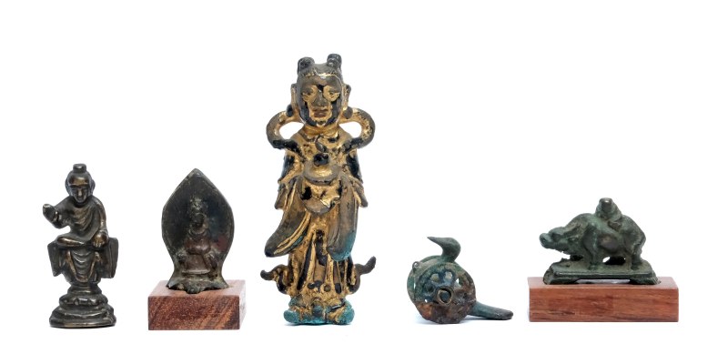 A group of five small bronze figures