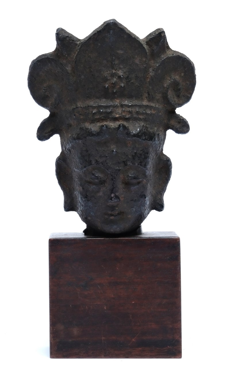An iron head of a Buddha