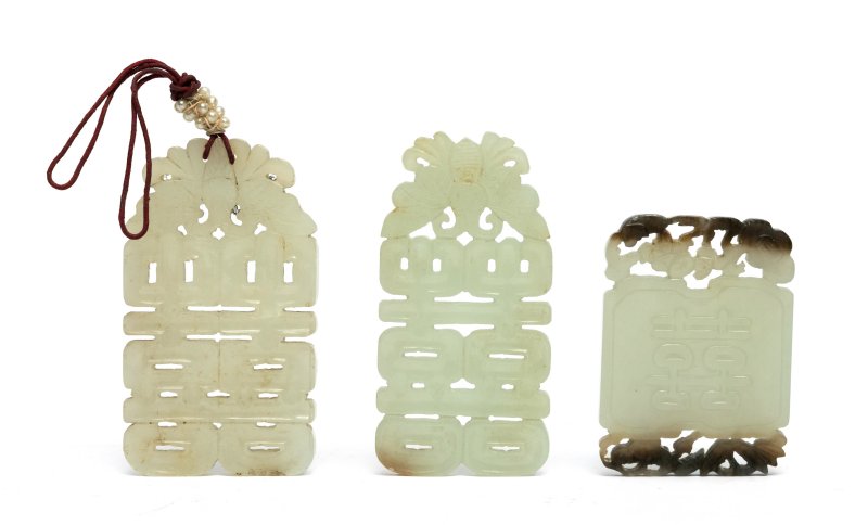 Three celadon jade 'Shou' pendant plaques