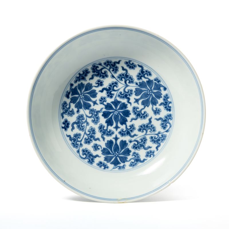 A blue and white 'lotus scroll' dish, Qianlong mark and of the period (1736-1795)