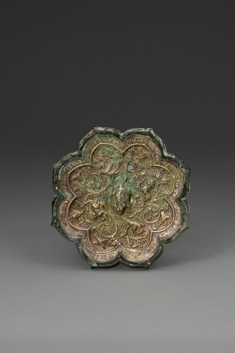 唐 銀背局部鎏金銅纏枝神獸紋菱花鏡  TANG DYNASTY (AD 618-907)