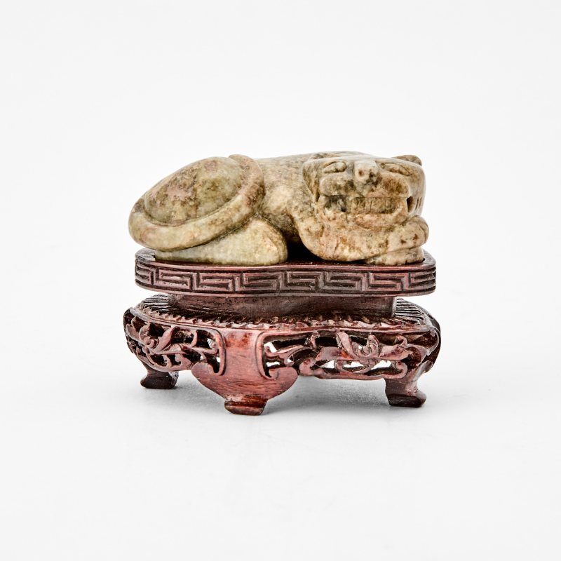 A Chinese Carved Mottled Jade Figural Carving