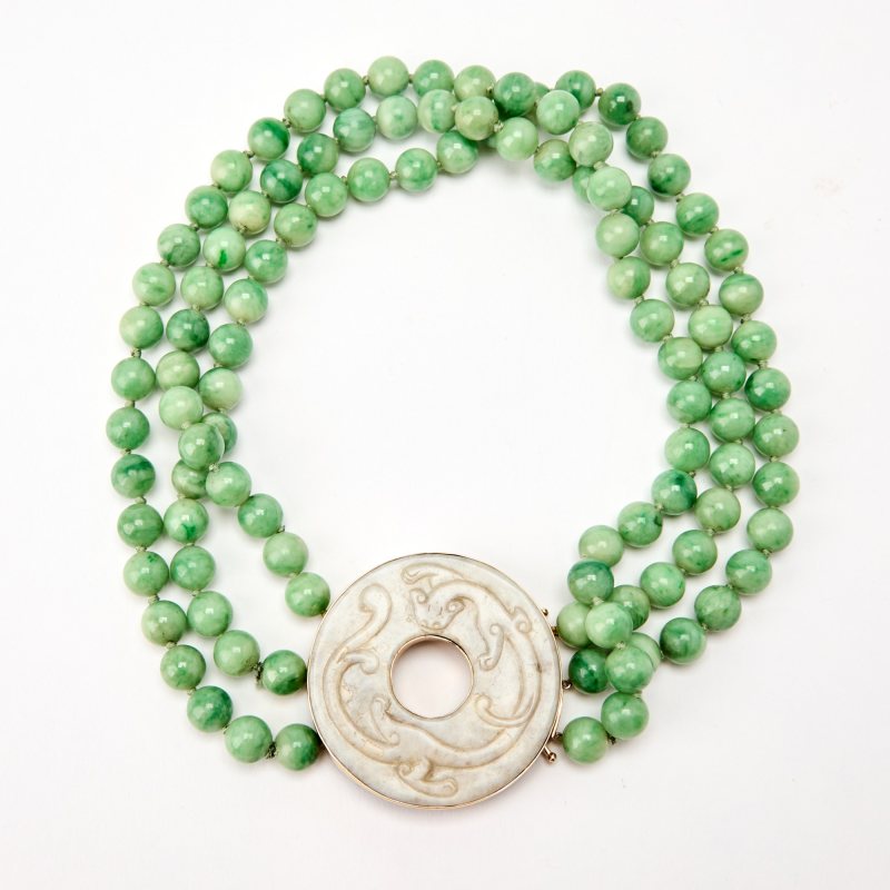 A Chinese Jadeite-Bead Necklace with a Carved White Jade Bi Pendant