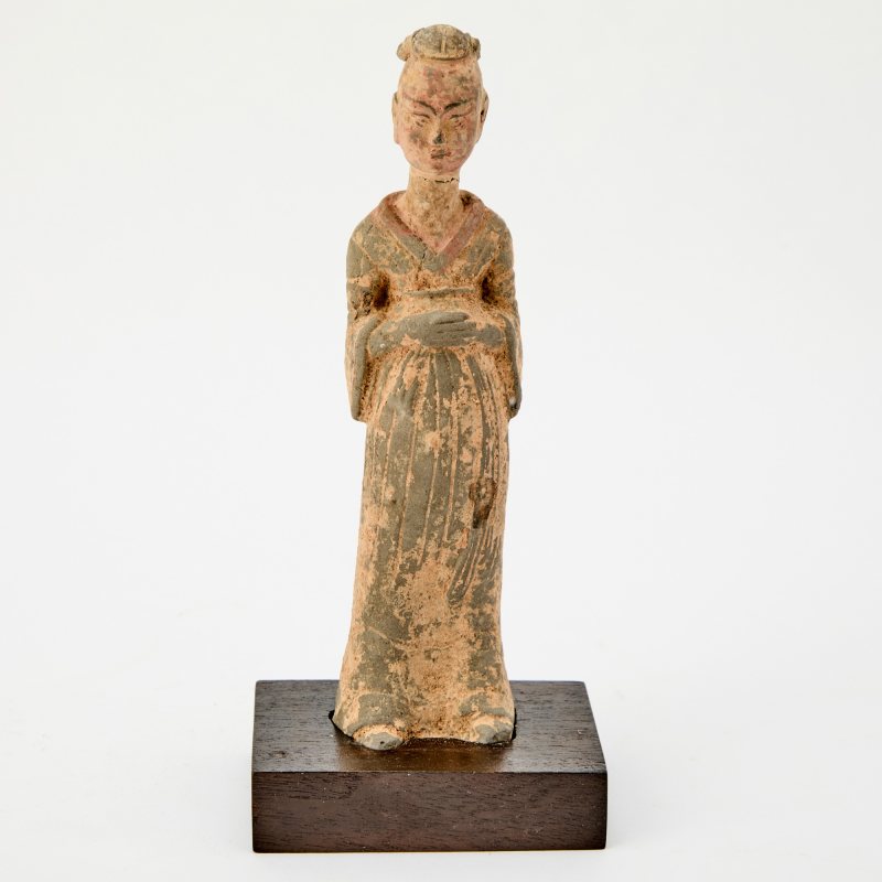 A Chinese Painted Pottery Figure of an Attendant