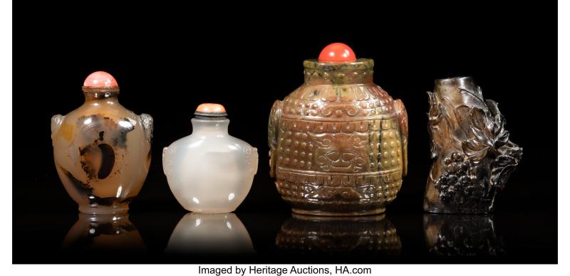 A Group of Four Chinese Carved Agate and Hardstone Snuff Bottles